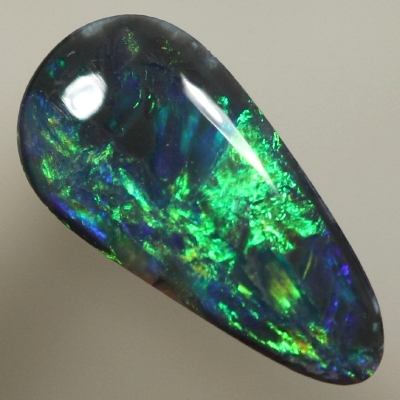 SOLID BLACK OPAL Bright orange plays along side green over blue